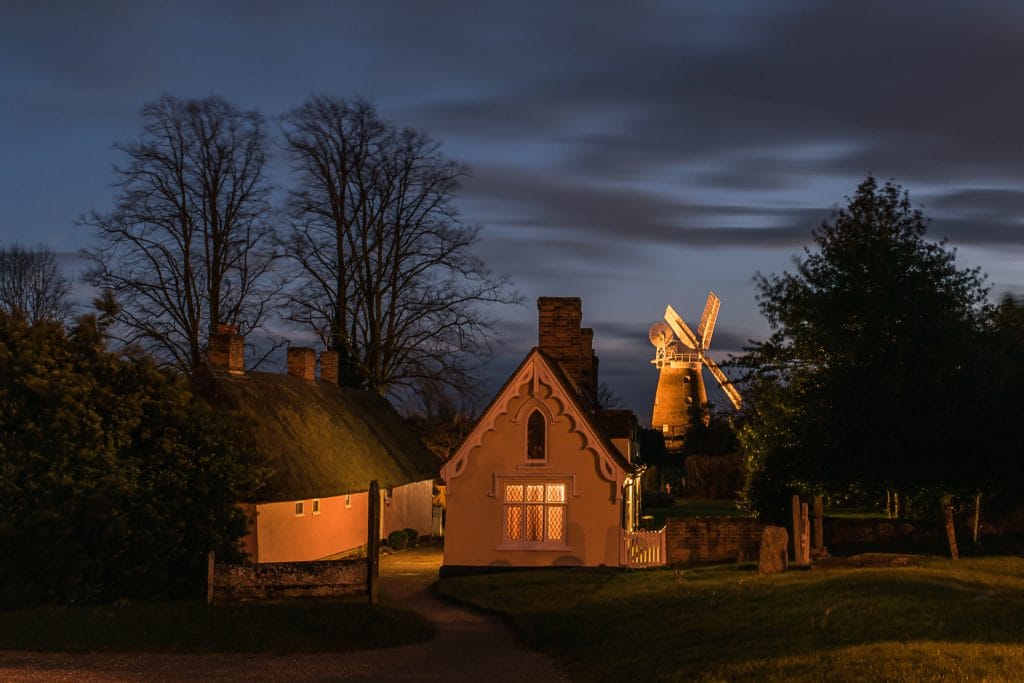 _DSC1916 Thaxted Essex Almshouses illuminated at night with windmill in background