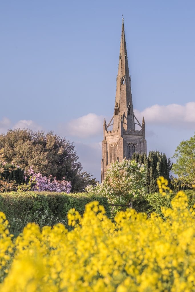 DSCF7316-2 Thaxted church with summer flowers